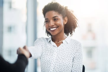 A young businesswoman shakes hands