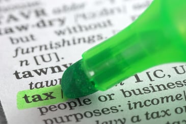 a green highlighter highlighting the word tax