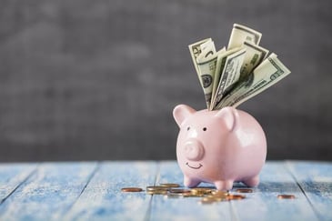 Saving money in a piggy bank