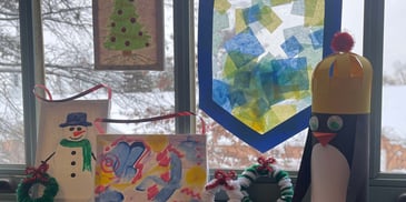 4 DIY crafts, including a dreidel, canvas painting, pipe cleaner wreaths, and a skiing penguin