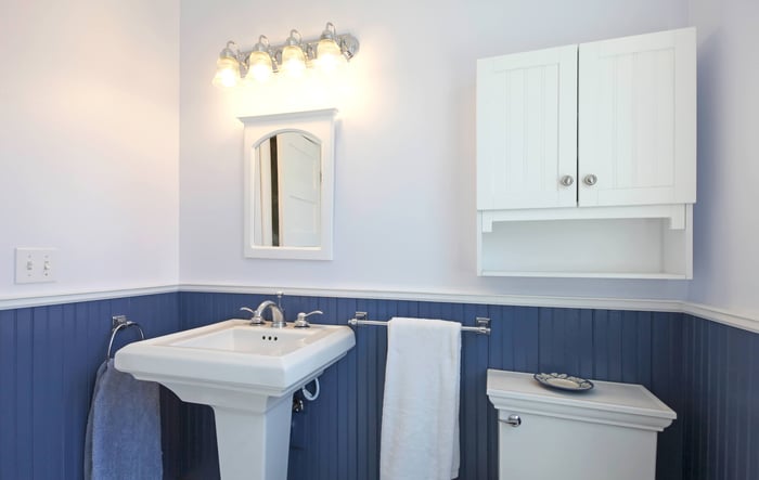 A bathroom showcasing an extra cabinet on the wall