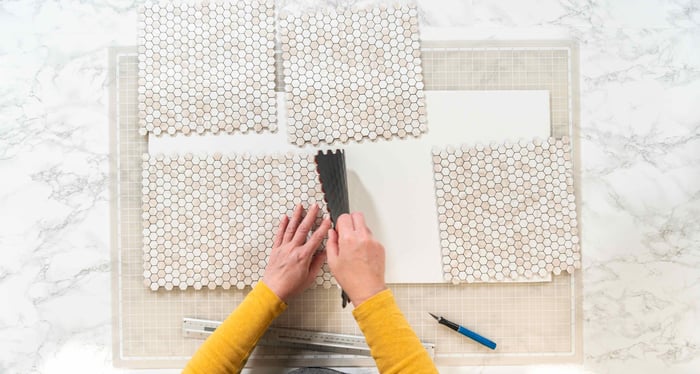 Cutting pieces of peel and stick tile to size