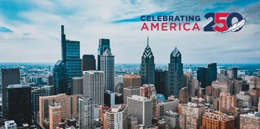 A skyline shot of Philadelphia featuring a 250th Celebrating America logo