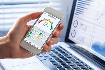 Close up of a smart phone showing a credit report on the screen