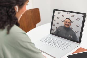 A woman speaking with a virtual advisor using VANA