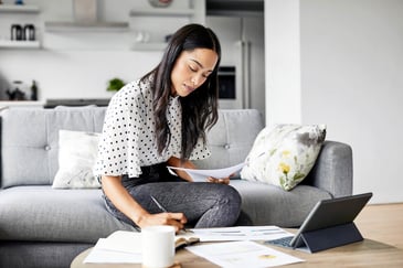 A woman manages her personal finances at home