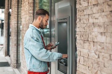 man-using-atm-machine