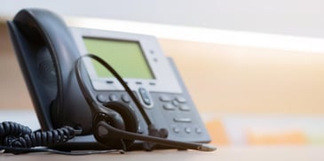Closeup of a phone system and headset