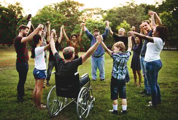 people-in-a-circle-outside-holding-hands-together