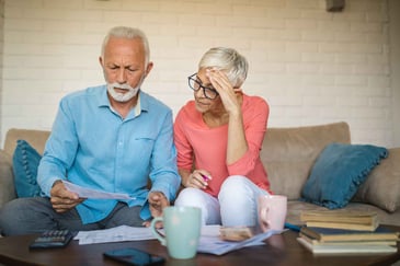 older-couple-looking-at-their-statement
