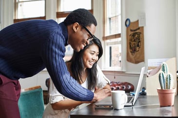 a couple using a laptop together