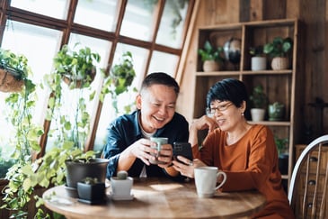 couple-looking-at-finances-on-their-phone