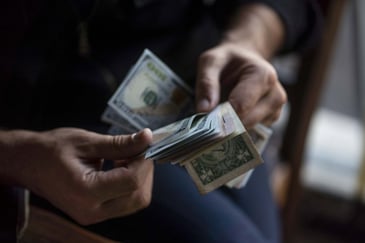 Hands holding cash