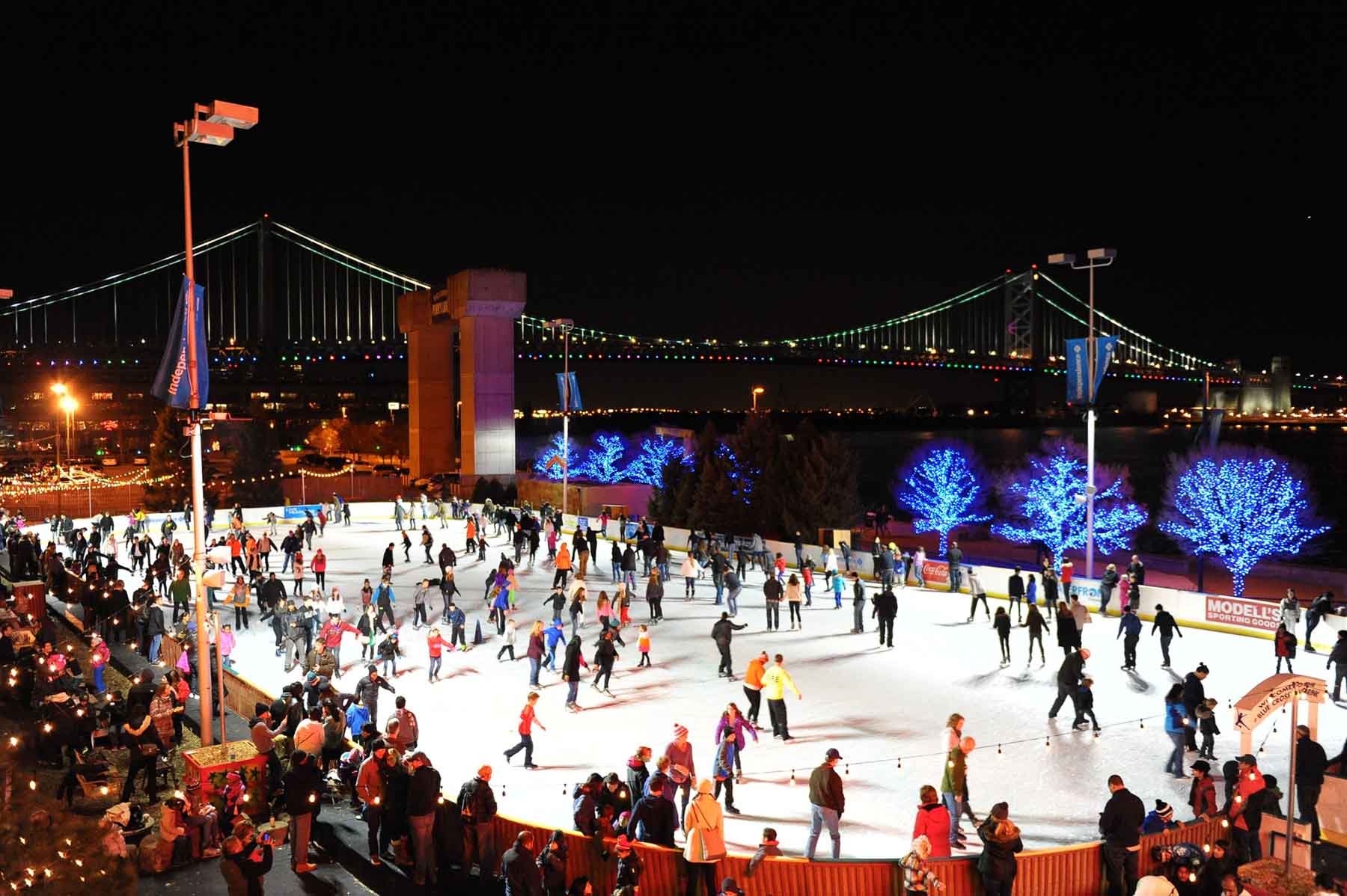 People Ice Skating at Night in Philadelphia