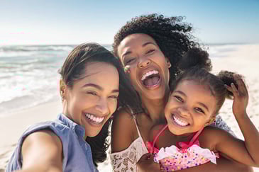 family-smiling-on-the-beach
