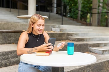 girl-putting-in-her-card-information-on-phone