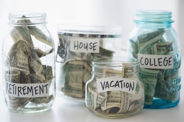 Jars of money labeled 
