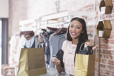 A woman shopping at a clothing store